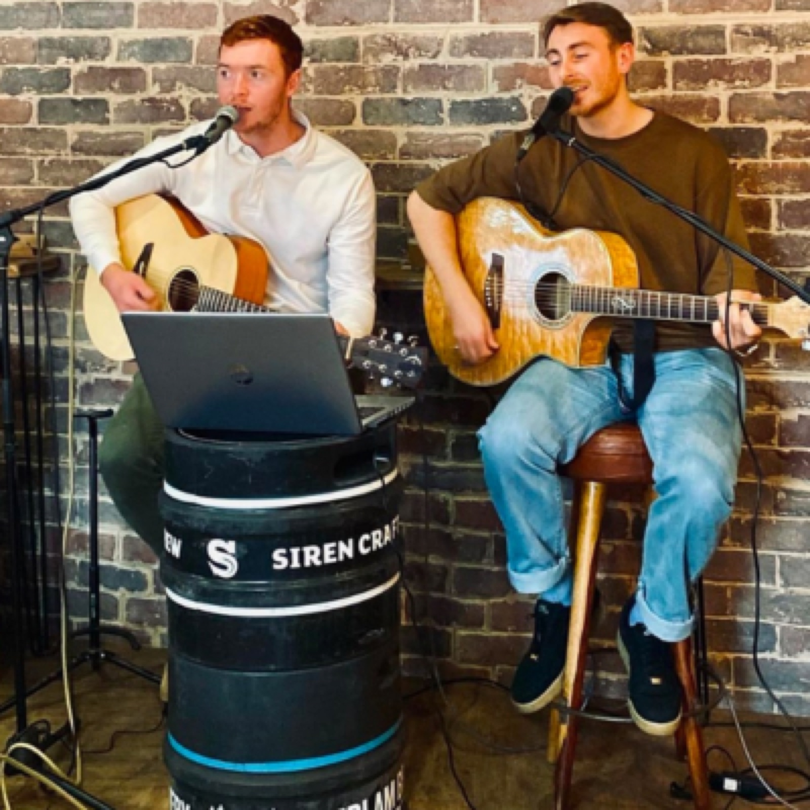 A live acoustic performance at the Refreshment Rooms micropub — musician on a small stage