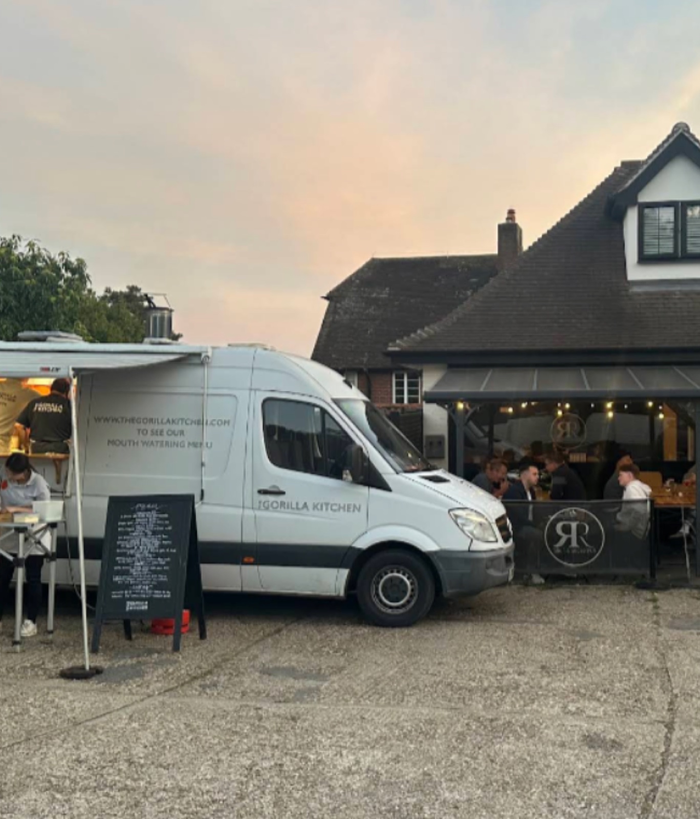 A busy food truck serving customers outside the Refreshment Rooms on a Friday evening