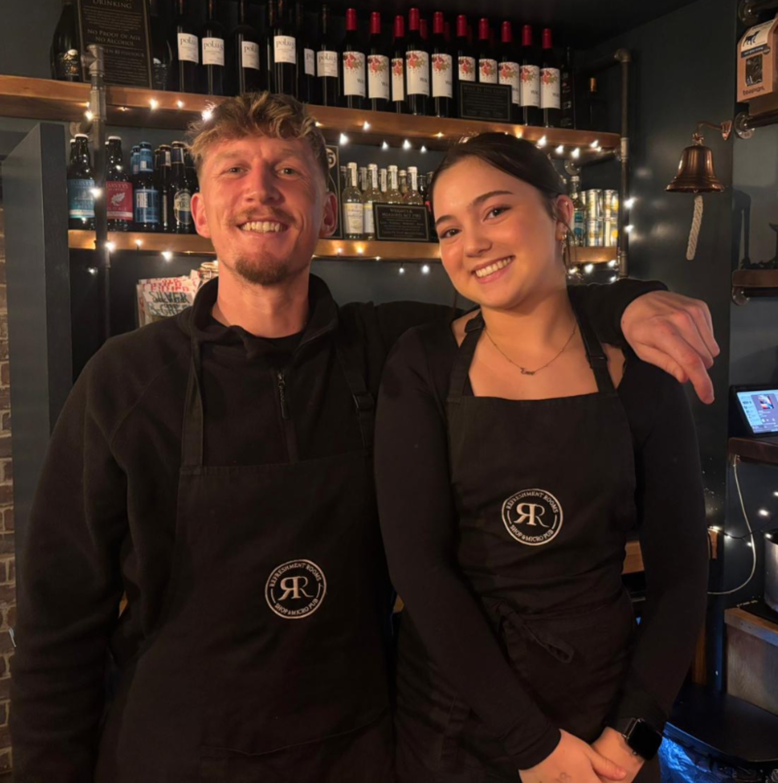 Staff at the Refreshment Rooms bar, smiling and welcoming